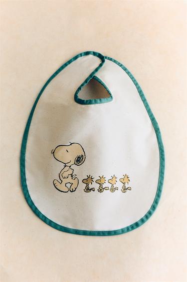 CHILDREN'S PEANUTS™ RESIN-COATED BIB - Cream by Zara