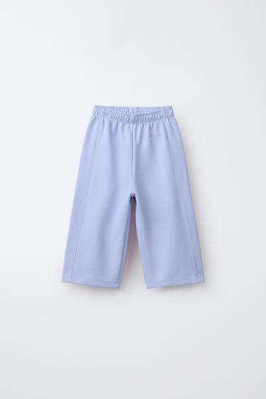 WIDE-LEG INTERLOCK TROUSERS WITH RAISED SLOGAN - Pastel blue by Zara