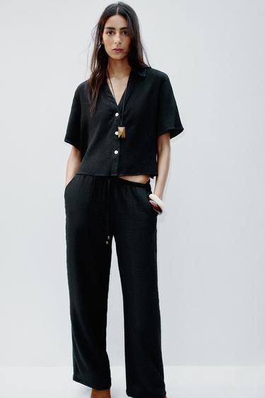 WIDE-LEG TROUSERS WITH ELASTIC WAISTBAND - Black by Zara