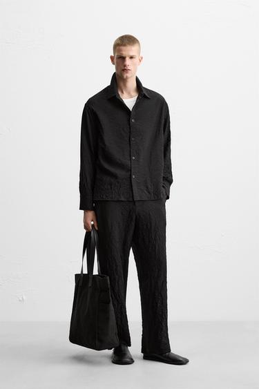 CREASED-EFFECT TROUSERS - Black by Zara - Image 0