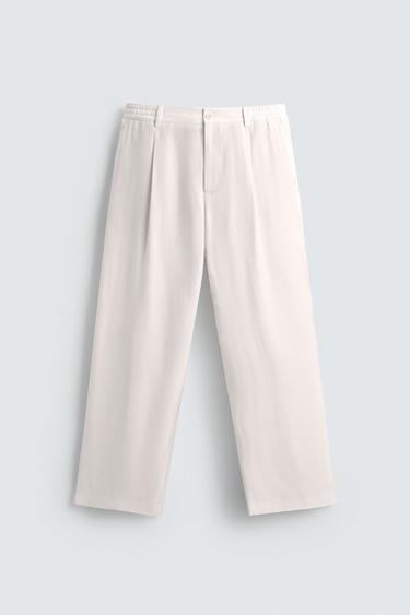RELAXED FIT PLEATED TROUSERS - White by Zara