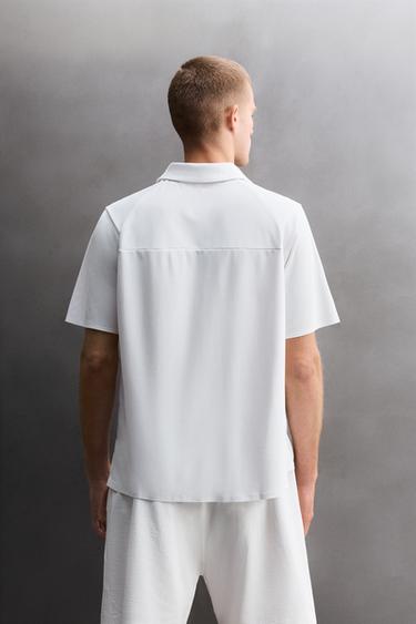 TECHNICAL PIQUÉ TEXTURE TRAINING POLO SHIRT - White by Zara