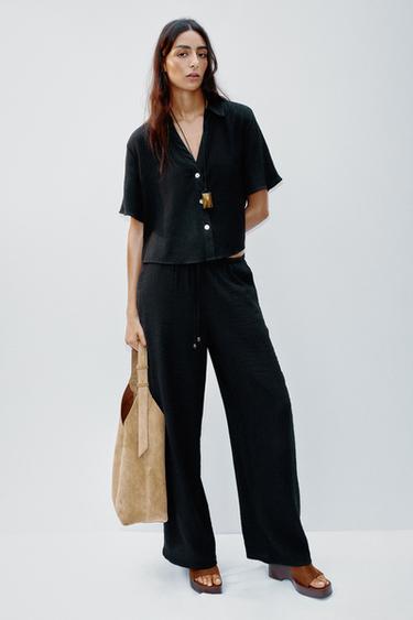 WIDE-LEG TROUSERS WITH ELASTIC WAISTBAND - Black by Zara