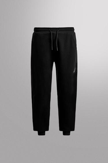 TECHNICAL TROUSERS WITH ZIP - Black by Zara