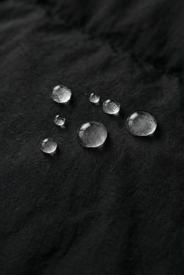 WATER-REPELLENT JACKET WITH HIDDEN HOOD UEFA CHAMPIONS LEAGUE ® - Black by Zara