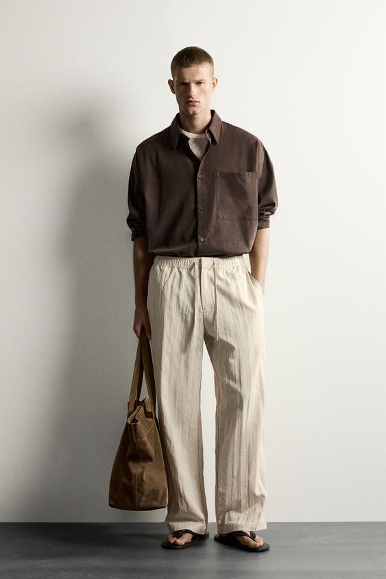 CRINKLED TECHNICAL RELAXED FIT TROUSERS - Beige by Zara - Image 0