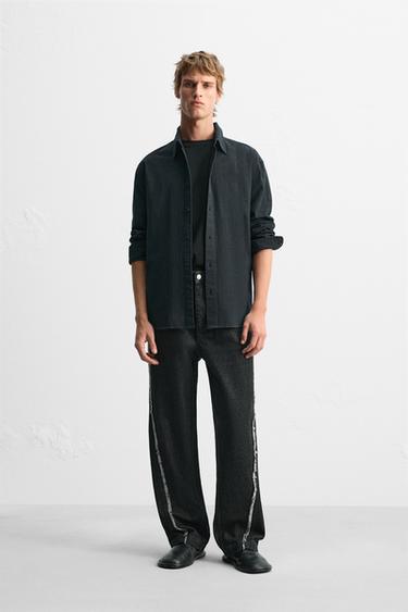 RELAXED FIT JEANS WITH FRAYED SEAMS - Black by Zara - Image 0