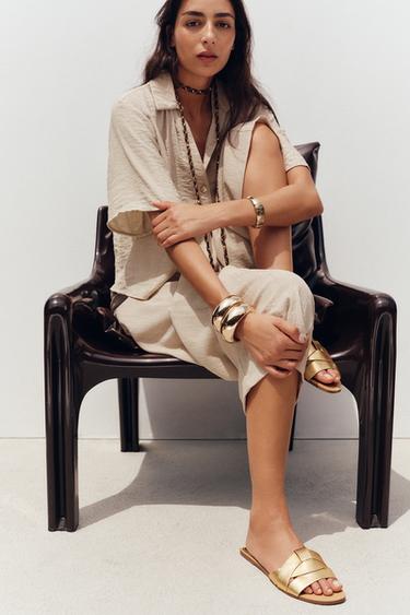FLAT CRISS-CROSS LEATHER SLIDER SANDALS - Gold by Zara