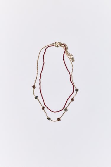 PACK OF TWO BEADED NECKLACES WITH FLOWERS - Maroon by Zara